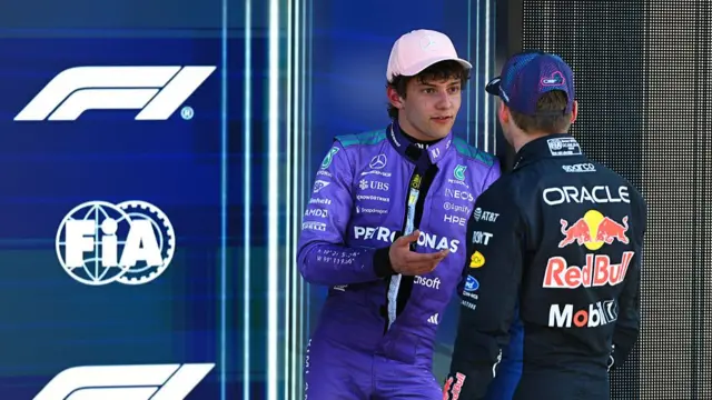 Kimi Antonelli speaking to Max Verstappen