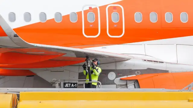An EasyJet plane is refuelled ahead of takeoff at Southend Airport on April 17, 2026 in Southend, England