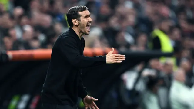Julian Schuster of Freiburg coach reacts