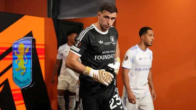 Emiliano Martinez of Aston Villa walks through the players tunnel at half-time