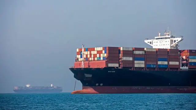 A cargo ship floating on the water