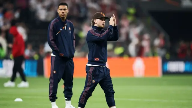Harvey Elliott of Aston Villa applauds the fans as he inspects the pitch