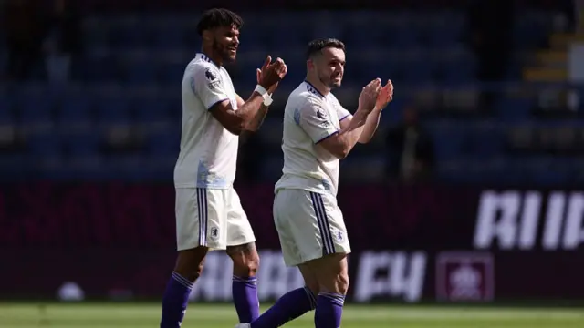 Tyrone Mings and John McGinn of Aston Villa applauds the fans following the draw during the Premier League match between Burnley and Aston Villa