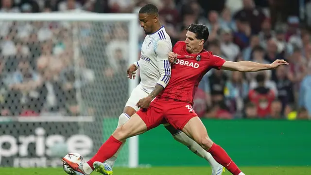 Ezri Konsa of Aston Villa is challenged by Igor Matanovic