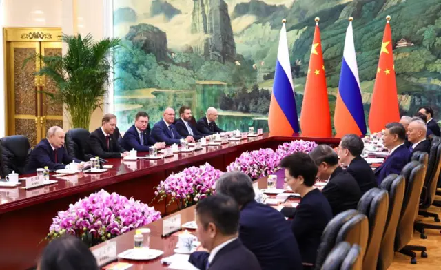 Russian President Vladimir Putin (L) and Chinese President Xi Jinping (C R) during their meeting in Beijing, China, 20 May 2026.