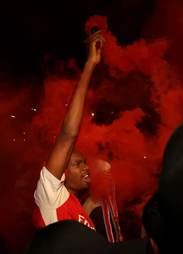 Arsenal fan with a flare