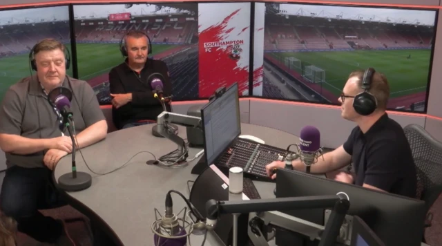 Three men sitting in a radio studio