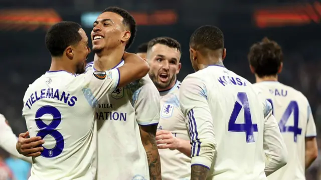 Youri Tielemans of Aston Villa celebrates with teammate Morgan Rogers