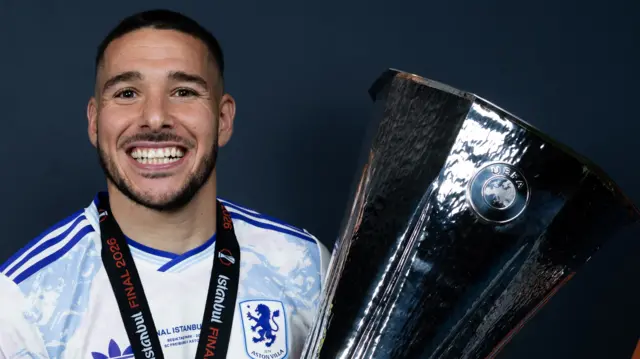Emi Buendia with the Europa League trophy