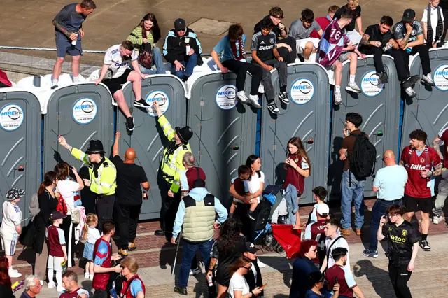 Waiting fans on top of toilets