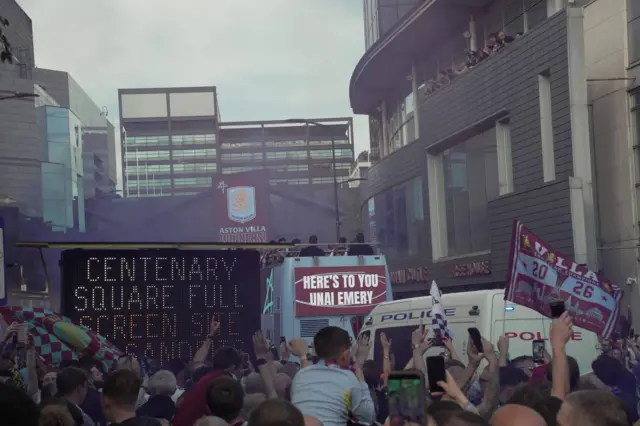 Aston Villa fans celebrate in Birmingham during the parade.