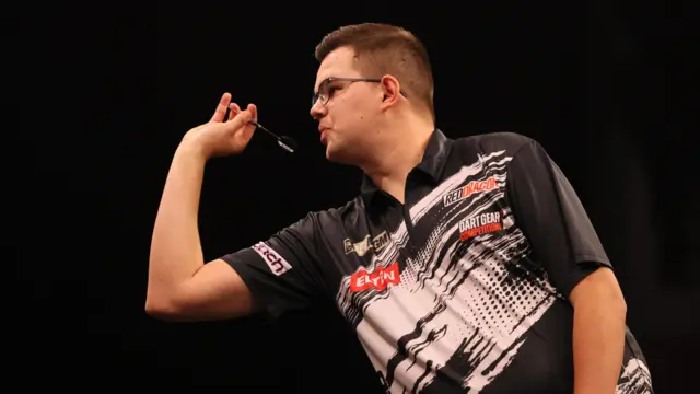 Gian van Veen in action against Gerwyn Price during night sixteen of the 2026 BetMGM Premier League at the Utilita Arena, Sheffield