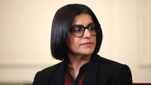 Shabana Mahmood looks to the side.