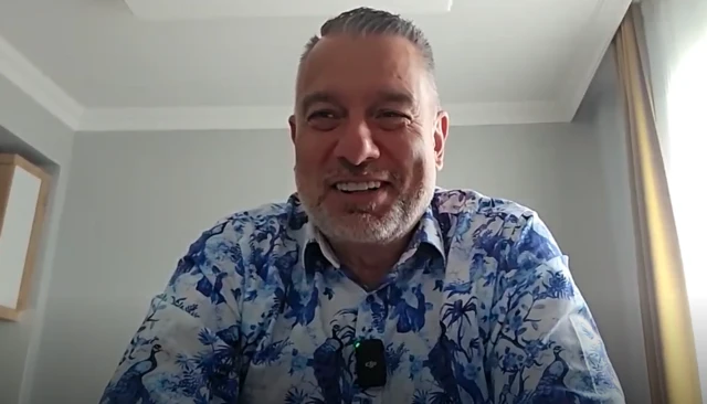 Guillem Balague wears a blue and white shirt