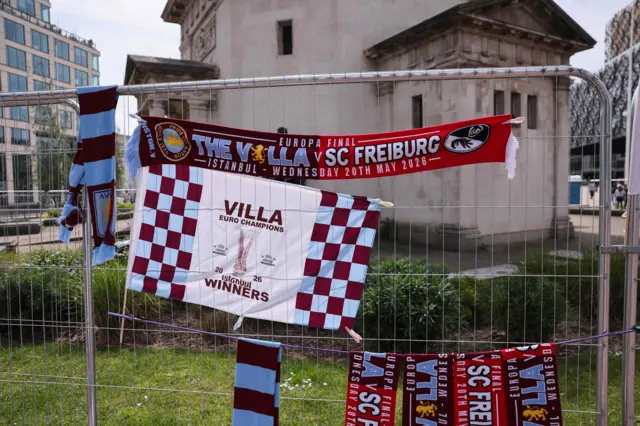 Scarfs tied to a fence