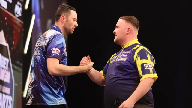 Luke Humphries and Luke Littler after their match during night sixteen of the 2026 BetMGM Premier League at the Utilita Arena, Sheffield