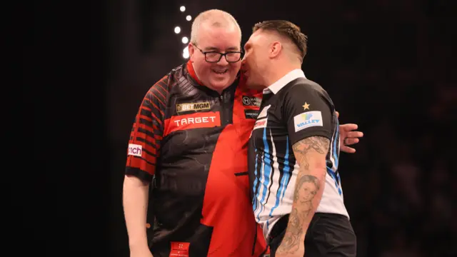 Gerwyn Price and Stephen Bunting after their match during night sixteen of the 2026 BetMGM Premier League at the Utilita Arena, Sheffield