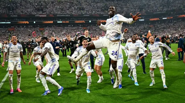 Amadou Onano leads a charge of Villa players jumping in the air