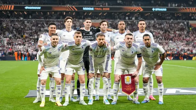 The Aston Villa squad pose for a photo before the game begins