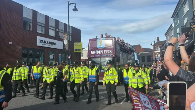 The Aston Villa parade bus travels down Hall Street, Birmingham