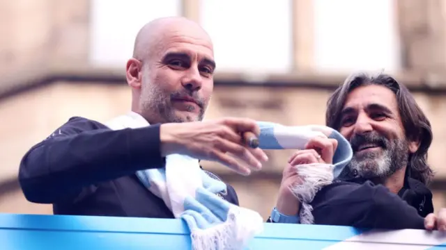 Pep Guardiola, Manager of Manchester City acknowledges the fans