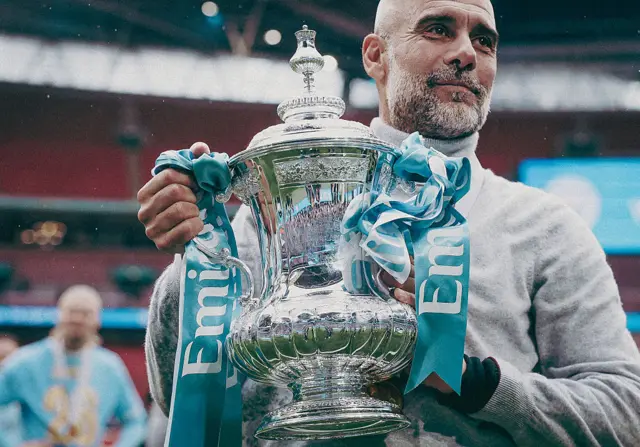 Pep Guardiola with the FA Cup trophy