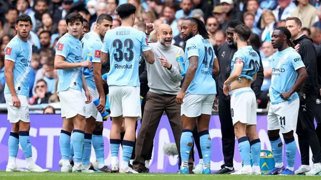 Pep Guardiola, Manager of Manchester City, issues instructions to his players