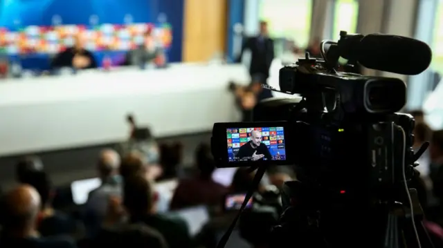 : A television camera films Pep Guardiola the head coach / manager of Manchester City