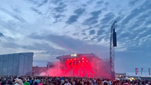 Lights fill the air as Fatboy Slim plays his set
