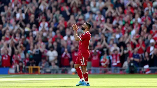 Mohamed Salah of Liverpool applauds the fan