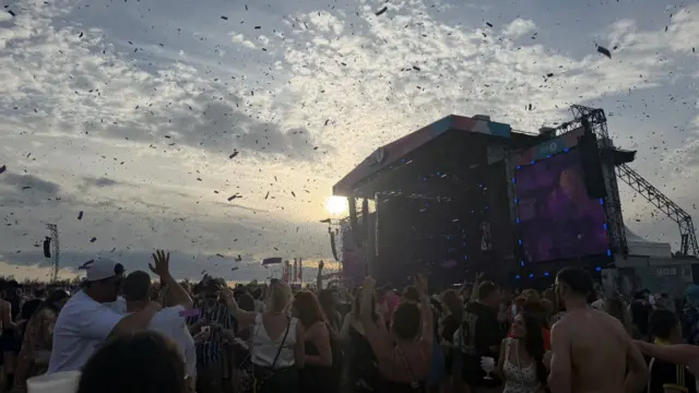 A view of the main stage at the Big Weekend as confetti is shot into the air above the huge crowd as MK brought out Poppy Baskcomb