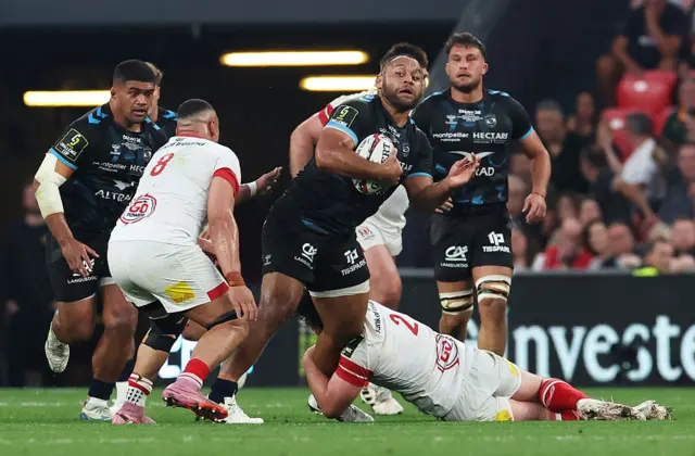 Billy Vunipola of Montpellier Herault Rugby is tackled by Juarno Augustus and Tom Stewart