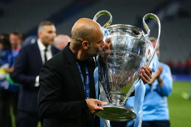 Pep Guardiola kisses the Champions league trophy