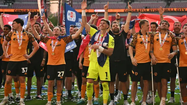 Hull players celebrate on the pitch