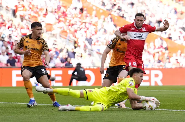 Hull City goalkeeper Ivor Pandur saves at the feet of Middlesbrough's Alan Browne (right)