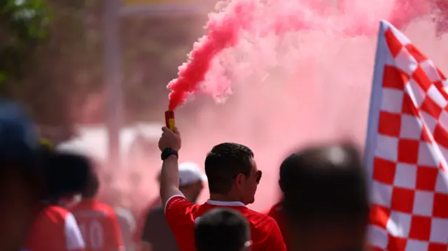 Middlesbrough fan with a red flare outside Wembley