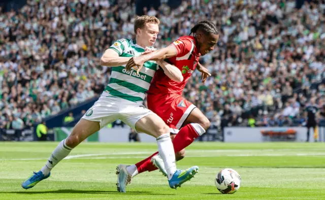 Celtic's Alistair Johnston (L) and Dunfermline's Kieran Ngwenya in action during the Scottish Gas Men's Scottish Cup Final between Celtic and Dunfermline Athletic at Barclays Hampden, on May 23, 2026, in Glasgow