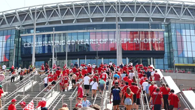 Fans head into Wembley Stadium