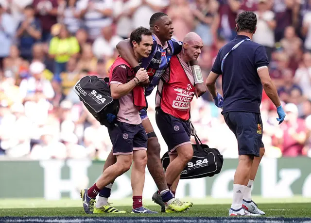 Cameron Woki walks off