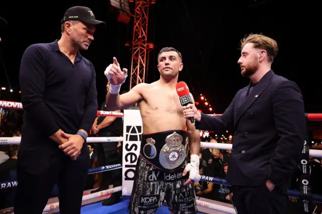 Eddie Hearn and Jack Catterall are interviewed in the ring
