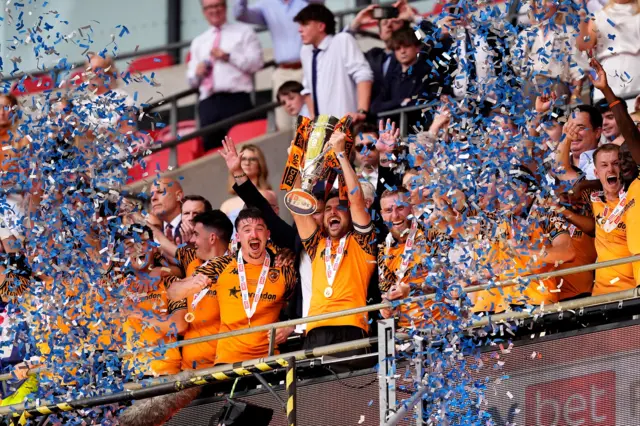 Lewie Coyle lifts the trophy for Hull City