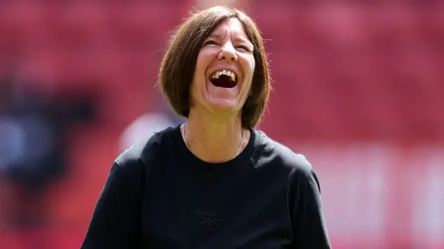 Karen Hills, Manager of Charlton Athletic, laughs during warm up