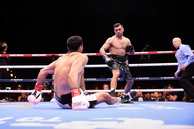 Shakhram Giyasov is on the canvas as Jack Catterall stands over him