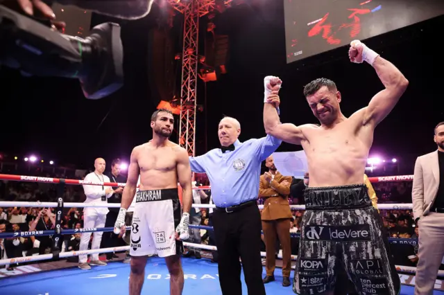 Jack Catterall has his hand raised