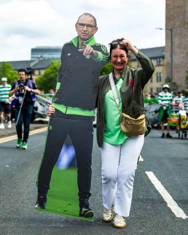A Celtic Fan with a Cardboard cutout of Martin O'Neill during a fan march from Glasgow Green to Hampden before the Scottish Gas Men's Scottish Cup Final between Celtic and Dunfermline Athletic at Barclays Hampden