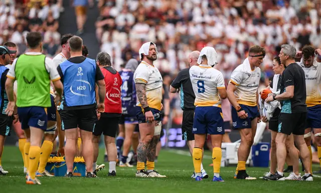Andrew Porter of Leinster, centre, during a water break