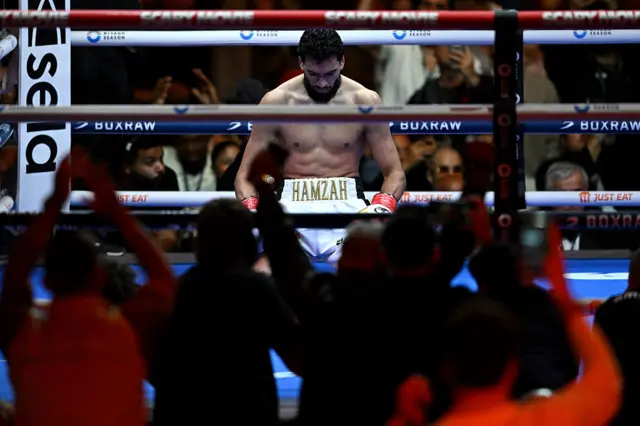 Hamzah Sheeraz celebrates on his knees in the ring