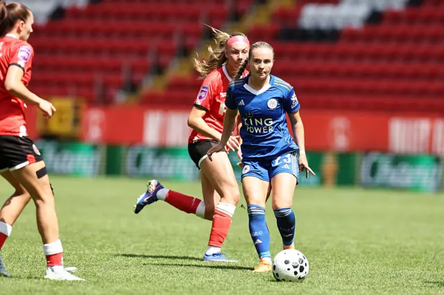 McLoughlin plays a pass forward under pressure