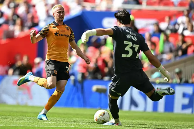Middlesbrough's English goalkeeper #31 Sol Brynn (R) clears the ball under pressure from Hull City's Canadian midfielder #07 Liam Millar (L)