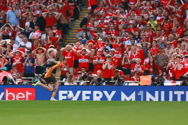 Boro fans look distraught as Oli McBurnie celebrates Hull's winner
